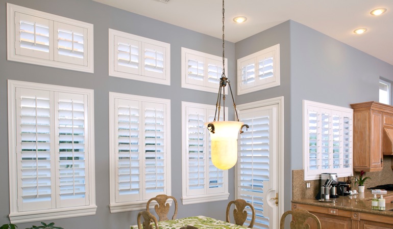 White plantation shutters in dining room